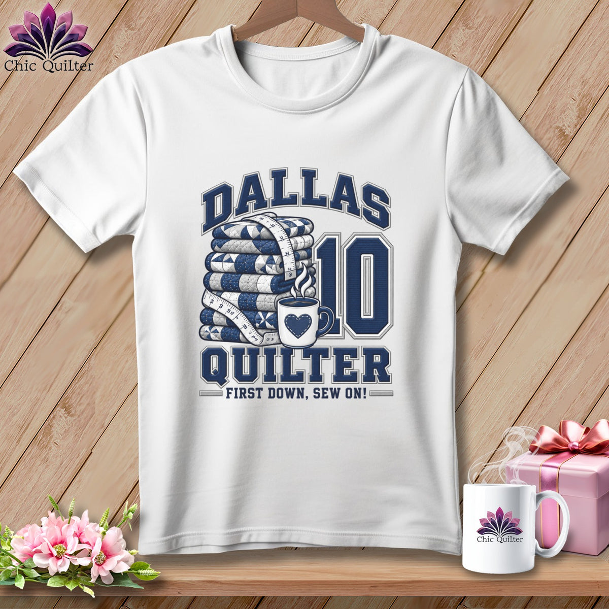 A white t-shirt features blue text reading Dallas Quilter, a stack of quilts, and the number 10.