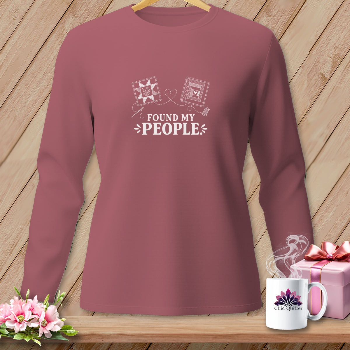 Dusty rose long-sleeved shirt with white graphic "Found My People" and quilt motifs.