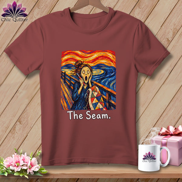 Maroon t-shirt with "The Scream" art featuring a quilter and "The Seam." text.