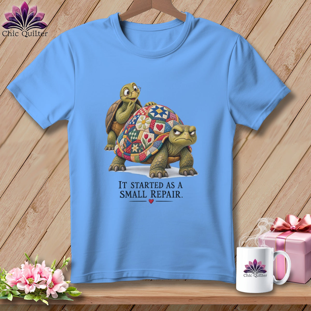 Light blue t-shirt with two turtles and text "IT STARTED AS A SMALL REPAIR."