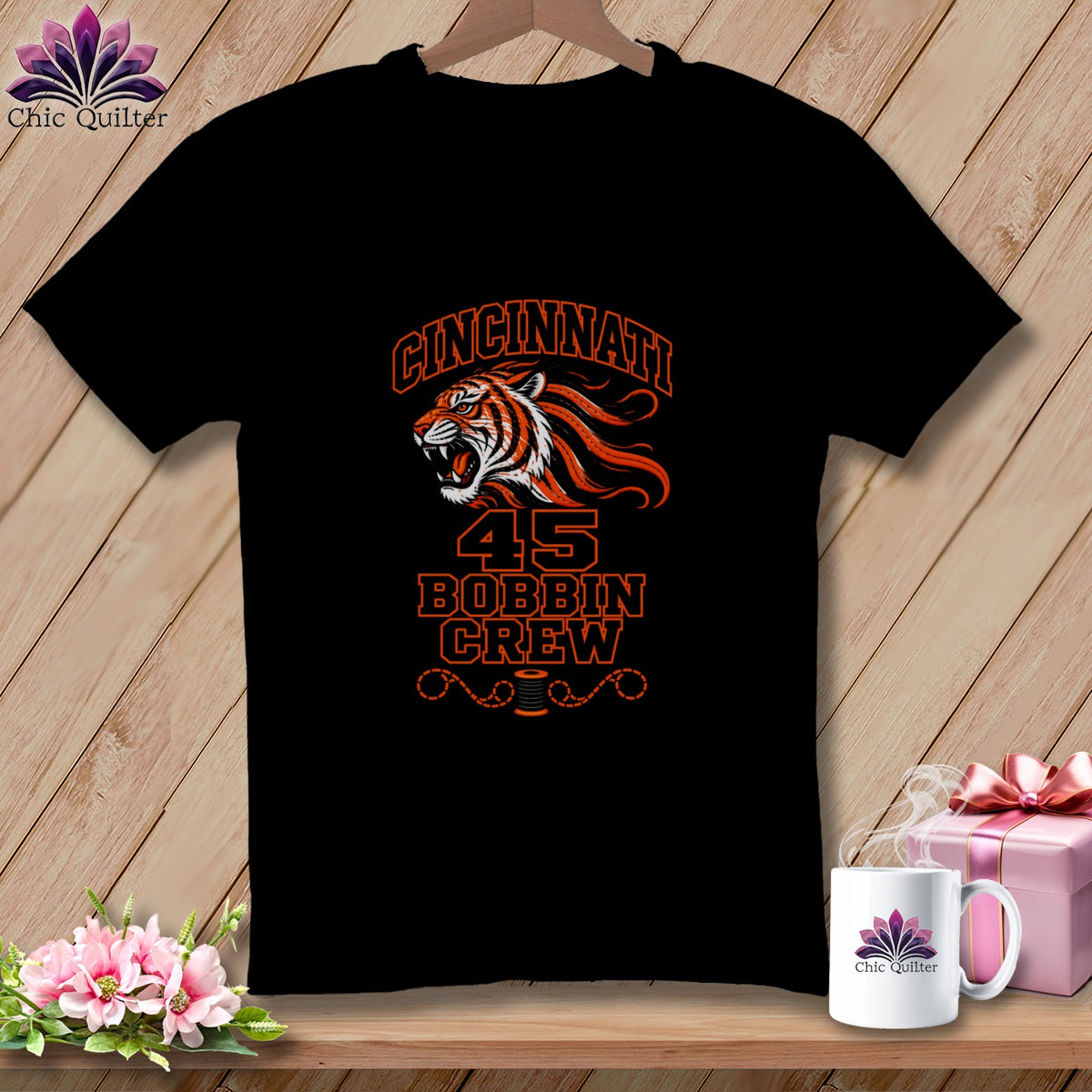 A black t-shirt featuring an orange and white tiger graphic with the text Cincinnati 45 Bobbin Crew.