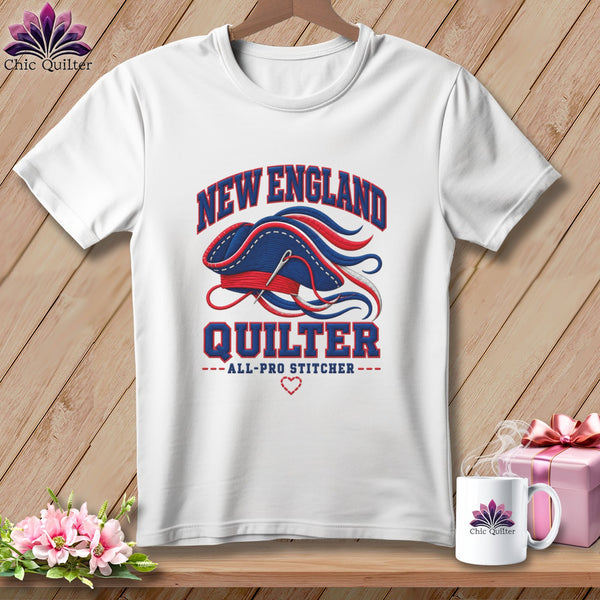 White t-shirt with a New England Quilter graphic featuring a tricorn hat, needle, and text.