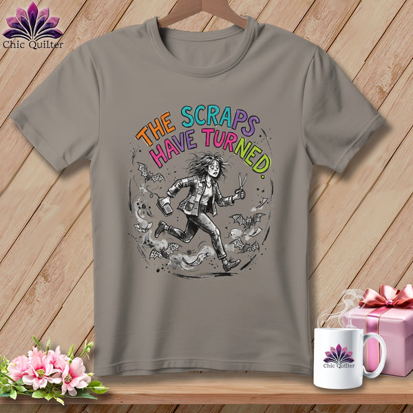 T-shirt with graphic of a person running from bats with text "The Scraps Have Turned".