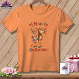 Orange t-shirt featuring a moose wearing a quilt and the text I Moose-t Buy More Fabric.