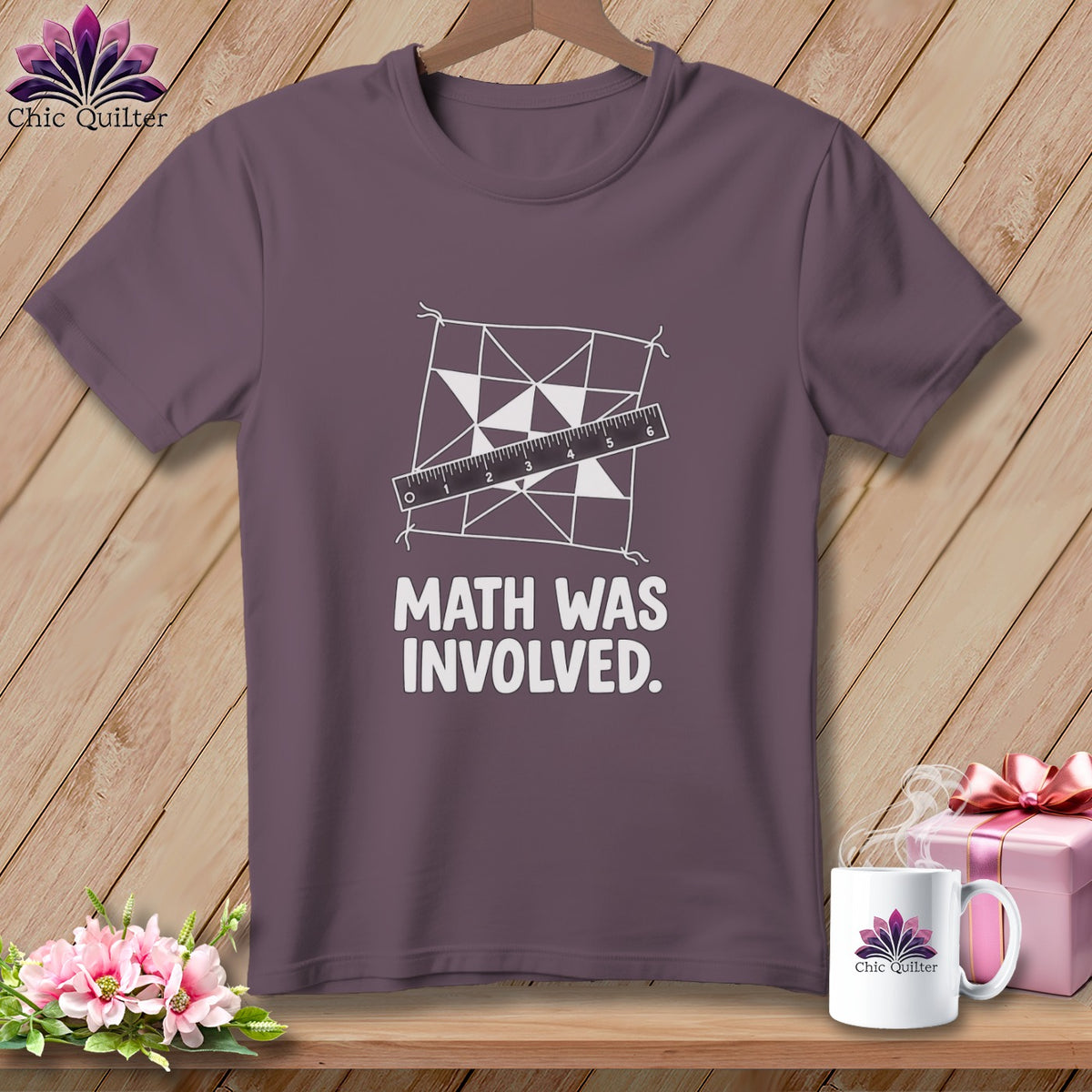 Purple t-shirt with quilt design, ruler, and text "MATH WAS INVOLVED."