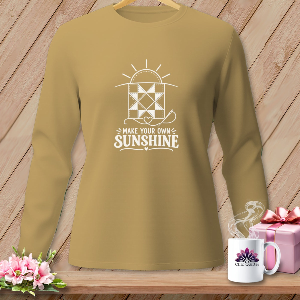 Tan long-sleeve shirt with white graphic saying "Make Your Own Sunshine."