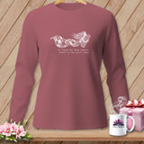 Long sleeve shirt with a girl and quilt graphic and text.