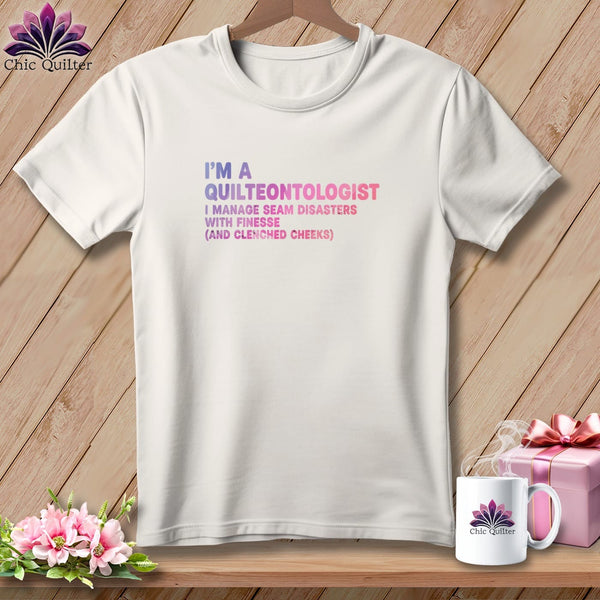 White t-shirt with "I'm a Quilteontologist" text and humorous quilting quote.