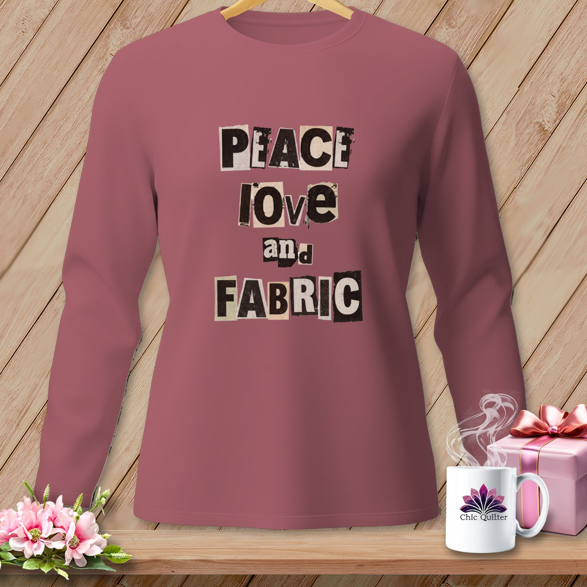 Rose long-sleeve shirt with "Peace Love and Fabric" text in ransom font.