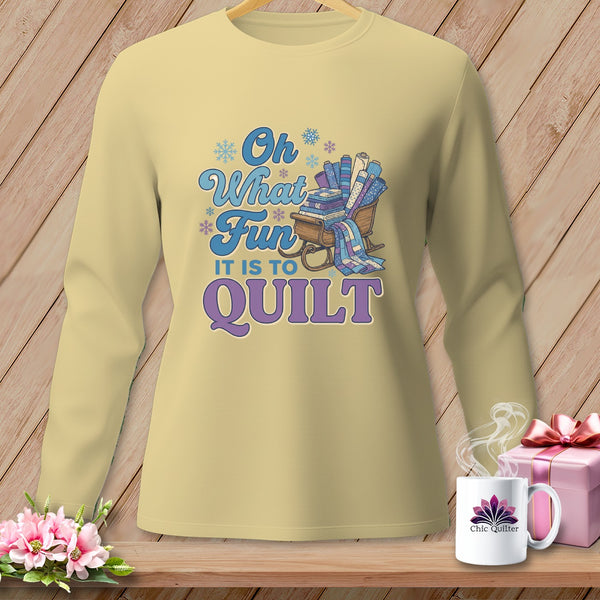 Light yellow long-sleeve shirt with "Oh What Fun It Is To Quilt" graphic.