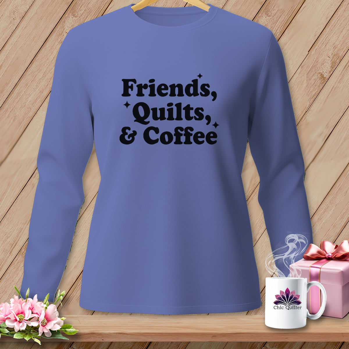 Purple long sleeve shirt with "Friends, Quilts, & Coffee" text and Chic Quilter logo mug.