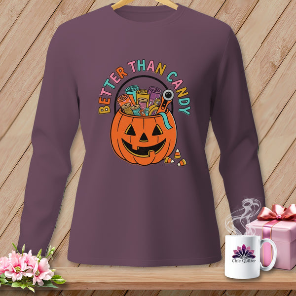 Purple long-sleeve shirt with a Halloween pumpkin design and "Better Than Candy" text.