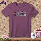 Plum t-shirt with quilting graphic text and flower, alongside a mug and gift box.