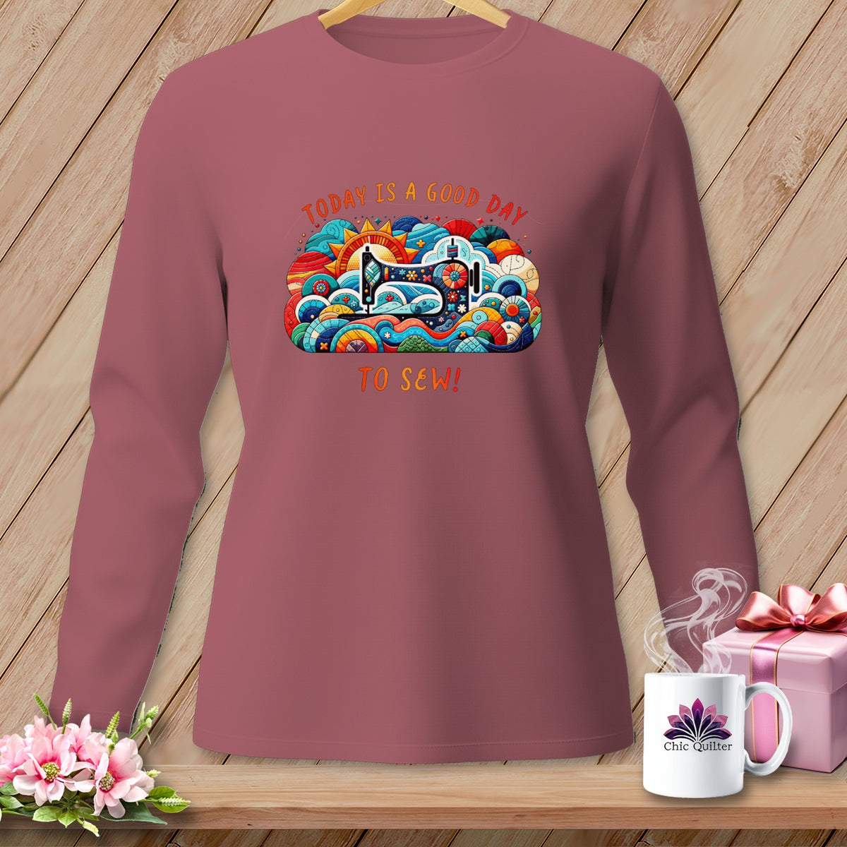 Pink long-sleeve shirt with "Today is a good day to sew!" graphic.