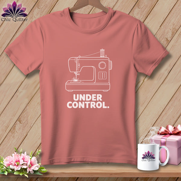 Pink t-shirt with white sewing machine graphic and "Under Control." text.