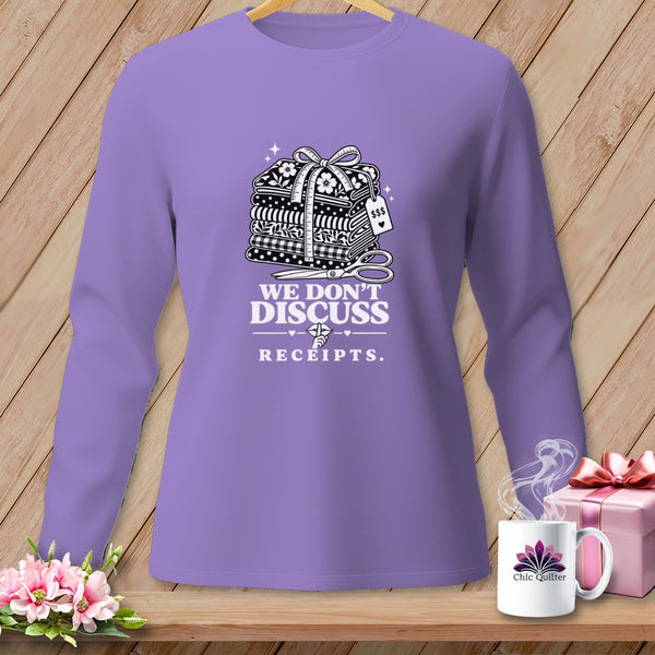 Purple long-sleeve shirt with "We Don't Discuss Receipts" graphic and fabric stack.