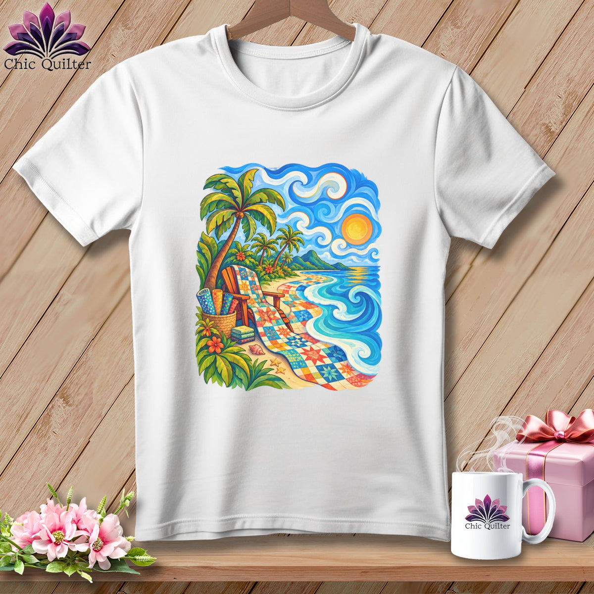 A white t-shirt featuring a colorful beach graphic with a patchwork quilt, palm trees, and ocean waves.