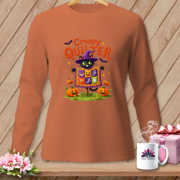 Orange long-sleeve shirt with Halloween graphic of black cat and "Creepy Quilter" text.