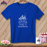 Blue t-shirt with a white line drawing of a house and the text 