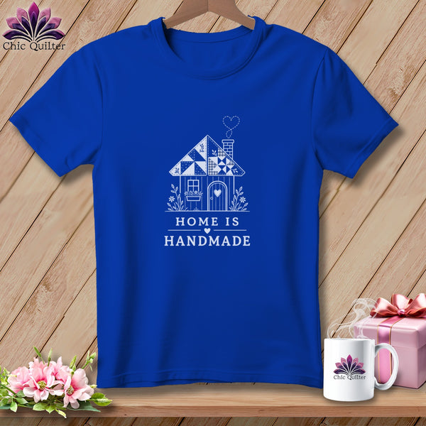 Blue t-shirt with a white line drawing of a house and the text "HOME IS HANDMADE".