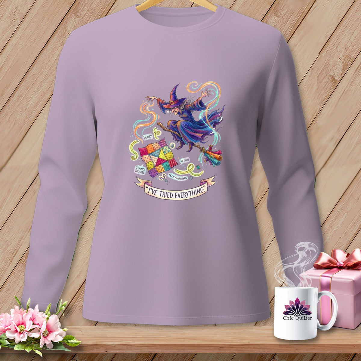 Long-sleeve shirt with a witch sewing a quilt, text says "I'VE TRIED EVERYTHING."