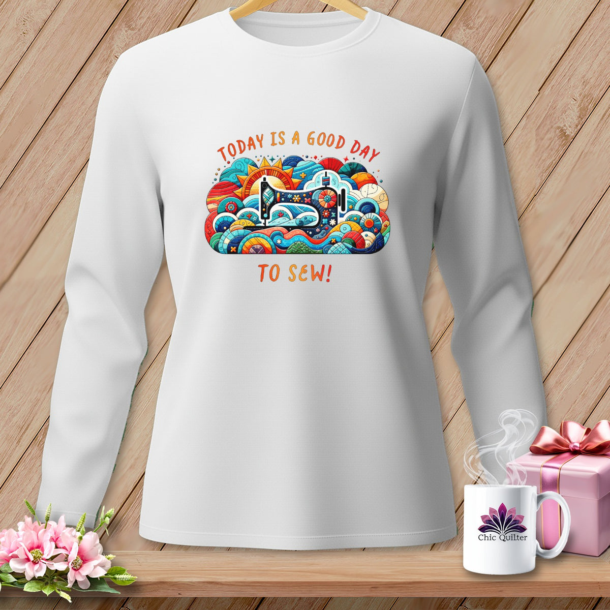 White long-sleeve shirt with "Today is a good day to sew!" and sewing machine graphic.