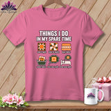 A pink t-shirt on a wooden background features quilting-themed graphics and text with activities like sewing and buying fabric.
