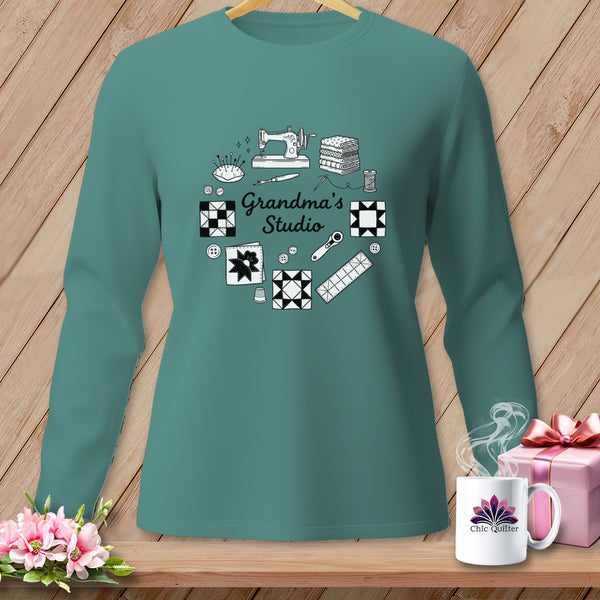 Teal long-sleeve shirt with "Grandma's Studio" and quilting motifs.