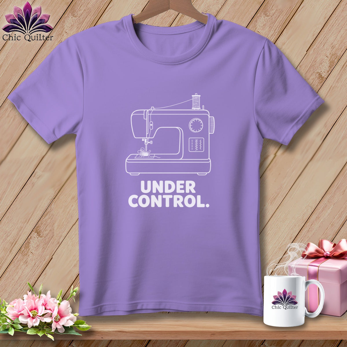 Purple t-shirt with white sewing machine graphic and text "UNDER CONTROL."