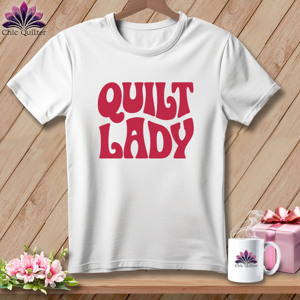 White t-shirt with "QUILT LADY" in bold pink lettering.