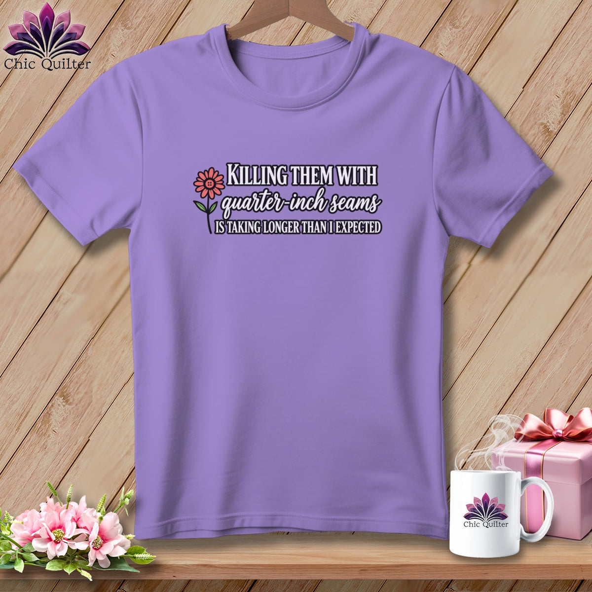 A purple crewneck t-shirt hangs on a hanger with text and a flower graphic on the chest.