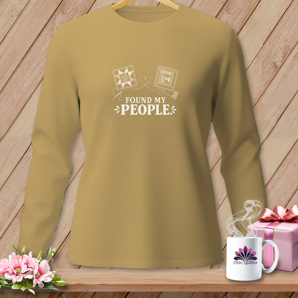 Tannish long-sleeve shirt with "Found My People" text and quilt designs.