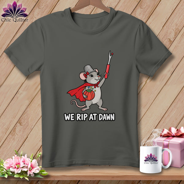 Dark gray t-shirt featuring a superhero mouse holding a seam ripper and the text WE RIP AT DAWN.