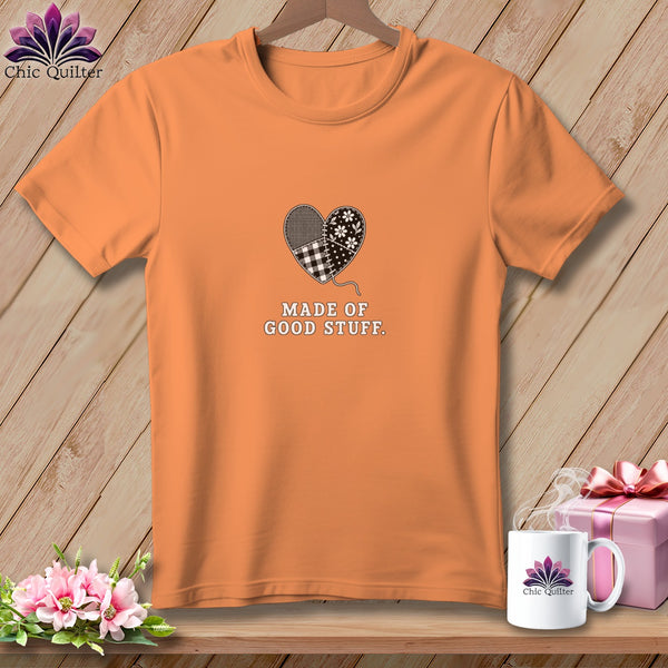 Orange t-shirt with patchwork heart graphic and text "MADE OF GOOD STUFF".