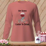 Pink long-sleeve shirt with graphic: wine glass, sewing notions, and text 