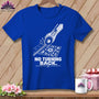Blue t-shirt with rotary cutter, ruler, and floral fabric graphic and text "NO TURNING BACK."