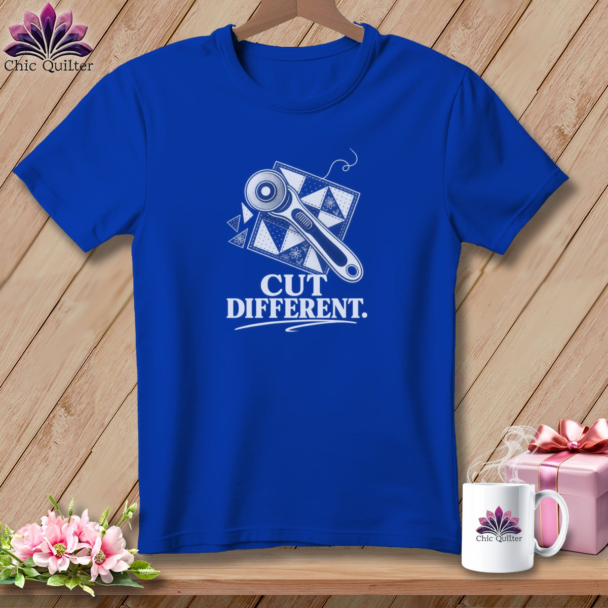 Royal blue t-shirt with rotary cutter and quilt square graphic, text reads "CUT DIFFERENT."
