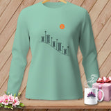 Mint green long-sleeve shirt with a graphic of spools of thread and a button.
