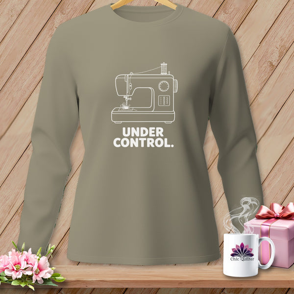 Long-sleeved taupe shirt with white sewing machine graphic and "UNDER CONTROL." text.