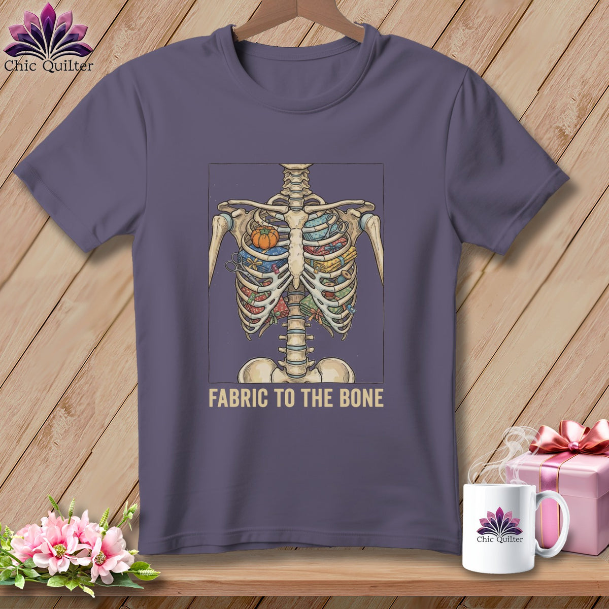 Purple t-shirt with a skeleton ribcage filled with fabric and sewing notions.