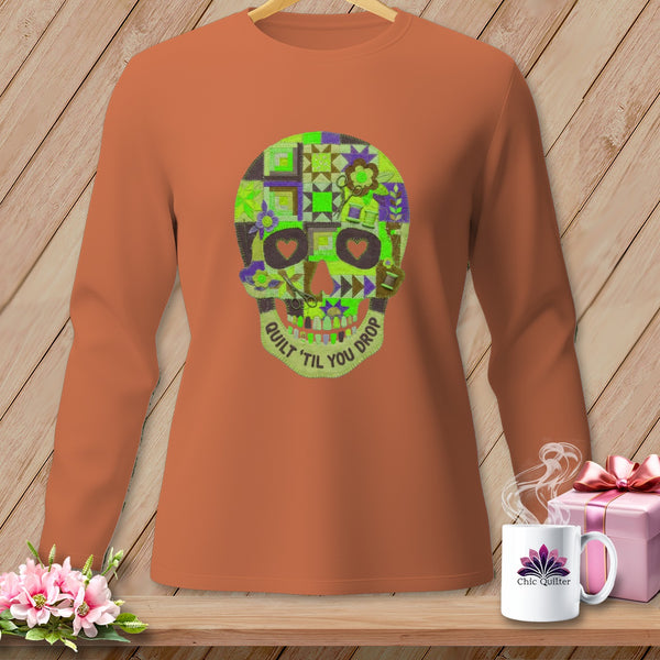 Long-sleeve t-shirt with a patchwork quilt skull design and "Quilt 'til You Drop" text.