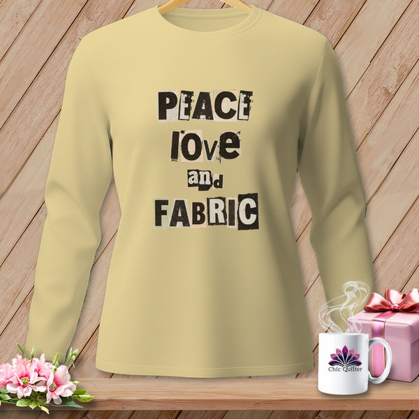Yellow long-sleeve shirt with "PEACE love and FABRIC" text and a mug.