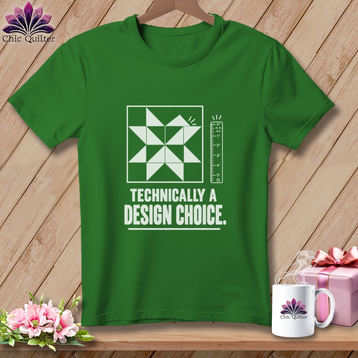 Green t-shirt with a quilt block graphic and "Technically a Design Choice" text.