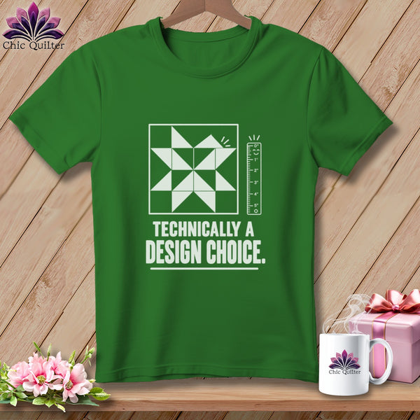 Green t-shirt with a quilt block graphic and "Technically a Design Choice" text.
