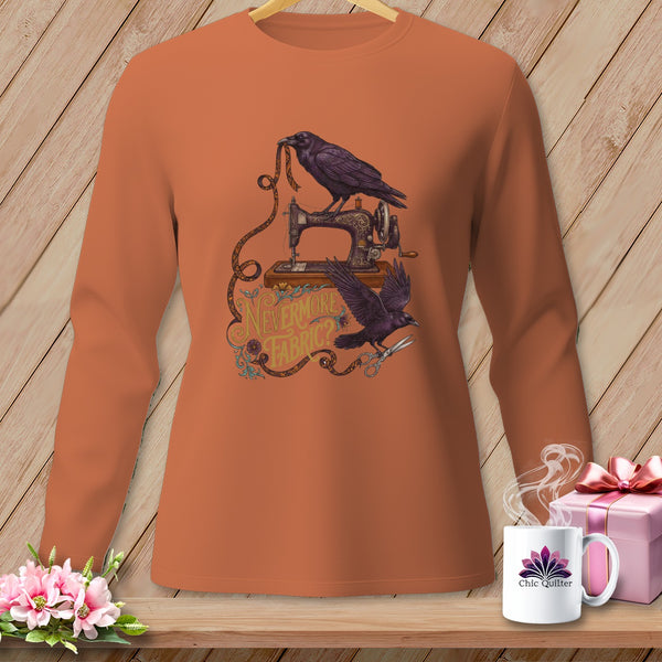 Orange long-sleeve shirt with ravens, sewing machine, and text "Nevermore Fabric?".