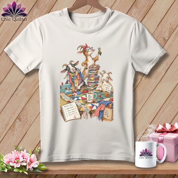 Three goats are quilting with fabric, a sewing machine, and supplies.