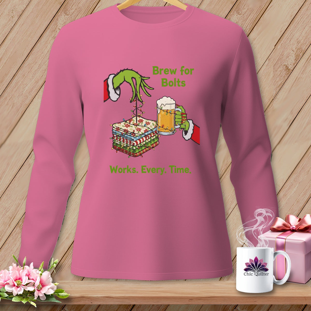 Grinch hands with beer and fabric stack, text "Brew for Bolts. Works. Every. Time."