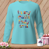 Aqua long-sleeve shirt with colorful patchwork text reading 