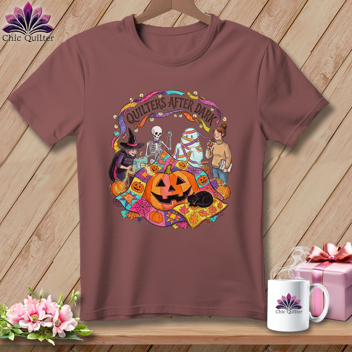 T-shirt with Halloween quilting theme featuring a witch, skeleton, mummy, and pumpkins.