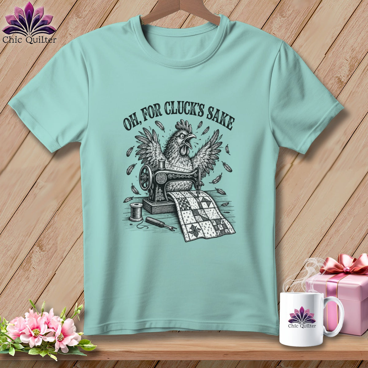T-shirt with chicken sewing a quilt, text "OH, FOR CLUCK'S SAKE".